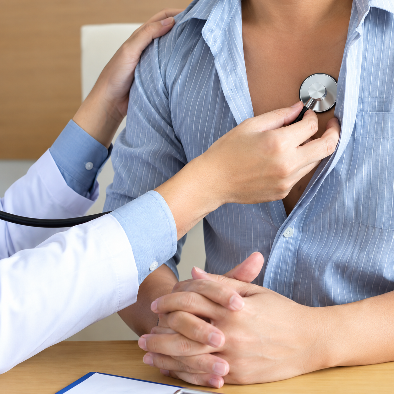 Doctor checking a patient's heart with a stethoscope, preventive heart health and annual physicals in Atlanta